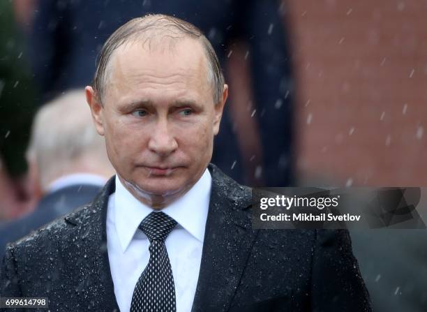 Russian President Vladimir Putin attends the wreath laying ceremony to the Unknown Soldier's Tomb at Alexander Garden outside of the Kremlin on June...