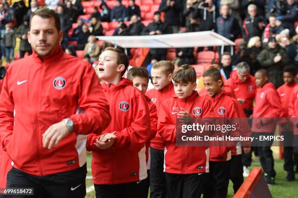 Charlton Athletic academy players parade around the ground at half time