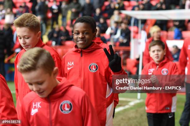 Charlton Athletic academy players parade around the ground at half time