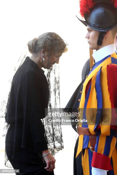 Queen Maxima is welcomed by the prefect of the papal household Georg Gaenswein as she arrives at the Vatican for an audience with Pope Francis on...