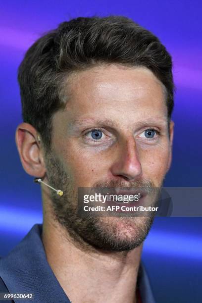 Haas F1's French driver Romain Grosjean speaks during the drivers press conference ahead of the Azerbaijan Grand Prix at the Baku City Circuit in...