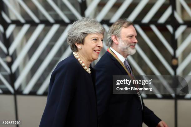 Theresa May, U.K. Prime minister, left, and Tim Barrow, U.K. Permanent representative to the European Union , arrive for a European Union leaders...