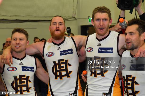 The Hawks players sing the club song after during the round 14 AFL match between the Adelaide Crows and the Hawthorn Hawks at Adelaide Oval on June...
