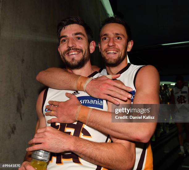 Ricky Henderson and Jack Gunston of the Hawks celebrate after the round 14 AFL match between the Adelaide Crows and the Hawthorn Hawks at Adelaide...