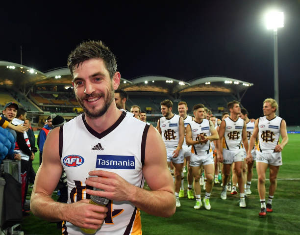 Ricky Henderson of the Hawks leads his team from the field after the round 14 AFL match between the Adelaide Crows and the Hawthorn Hawks at Adelaide...