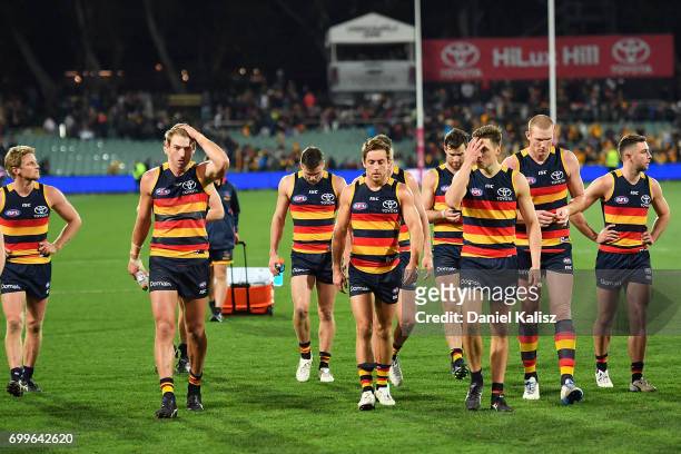 The Crows players walk from the field after the round 14 AFL match between the Adelaide Crows and the Hawthorn Hawks at Adelaide Oval on June 22,...