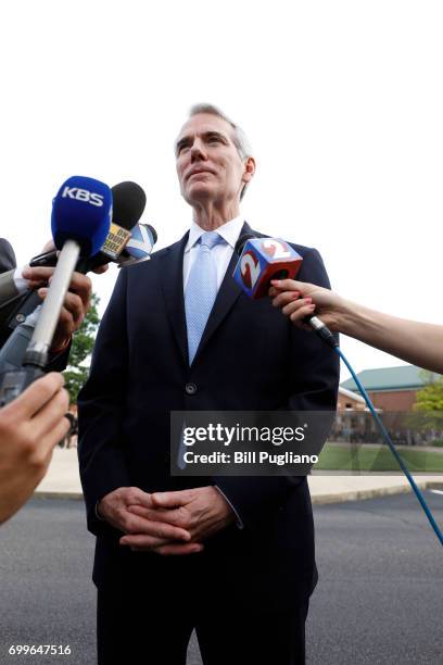 Ohio Sen. Rob Portman speaks with the news media as he arrives at Wyoming High School for the funeral of Otto Warmbier June 22, 2017 in Wyoming,...