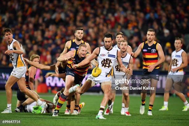 Jack Gunston of the Hawks kicks the ball dunksuring the round 14 AFL match between the Adelaide Crows and the Hawthorn Hawks at Adelaide Oval on June...