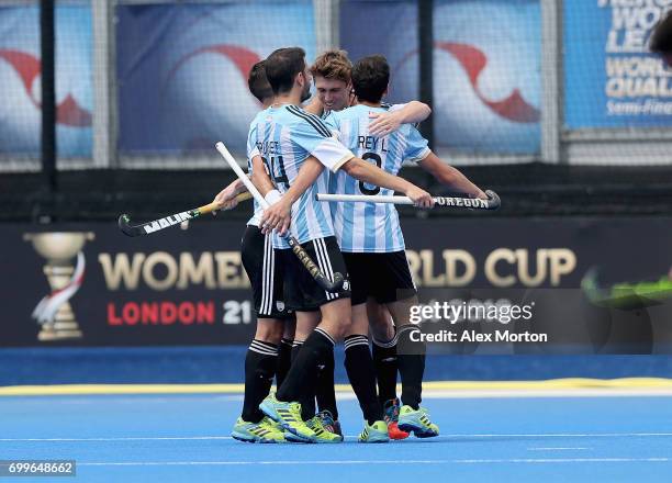 Maico Casella of Argentina celebrates scoring his teams first goal with teammates during the quarter final match between Argentina and Pakistan on...