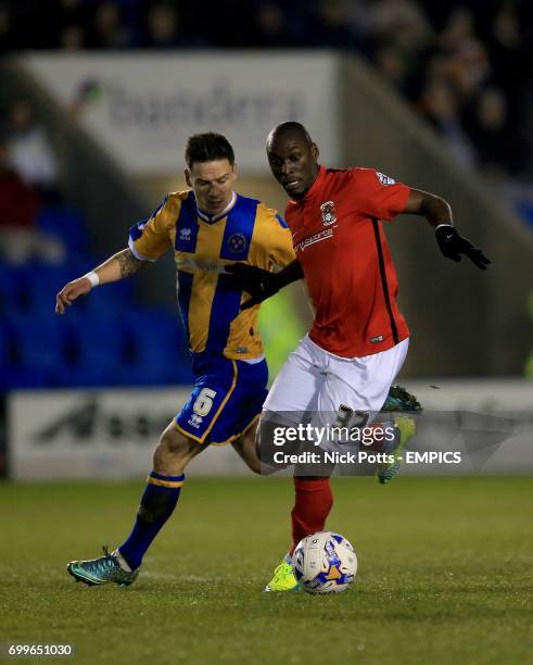 Shrewsbury Town's Ian Blackstone and Coventry City's Marc-Antoine Fortune battle for the ball