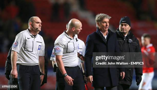 Charlton Athletic interim manager Jose Riga leaves the pitch with referee Charles Breakspear