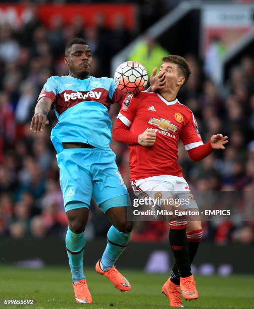 Manchester United's Gullermo Varela and West Ham United's Emmanuel Emenike battle for the ball
