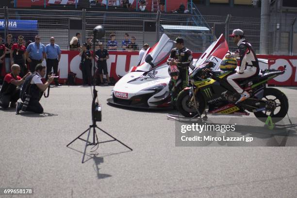 Johann Zarco of France and Monster Yamaha Tech 3 and Bruno Senna of Brasile pose with the bike and the car during the pre-event "A race between a...