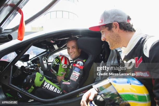 Johann Zarco of France and Monster Yamaha Tech 3 and Bruno Senna of Brasile pose during the pre-event "A race between a Yamaha M1 and a McLaren GT3"...