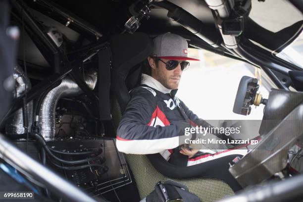 Bruno Senna of Brazil looks on during the pre-event "A race between a Yamaha M1 and a McLaren GT3" during the MotoGP Netherlands - Preview on June...