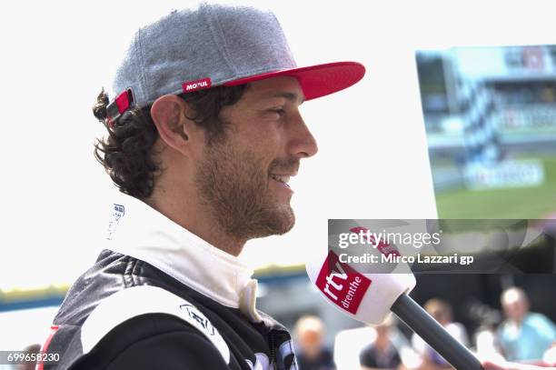 Bruno Senna of Brasile speaks with journalists durin the pre-event "A race between a Yamaha M1 and a McLaren GT3" during the MotoGP Netherlands -...