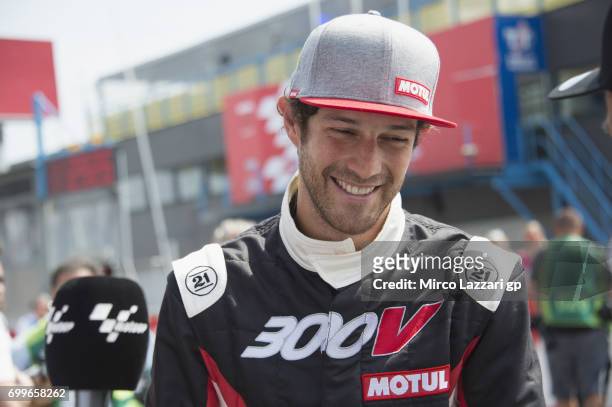 Bruno Senna of Brazil smiles during the pre-event "A race between a Yamaha M1 and a McLaren GT3" during the MotoGP Netherlands - Preview on June 22,...