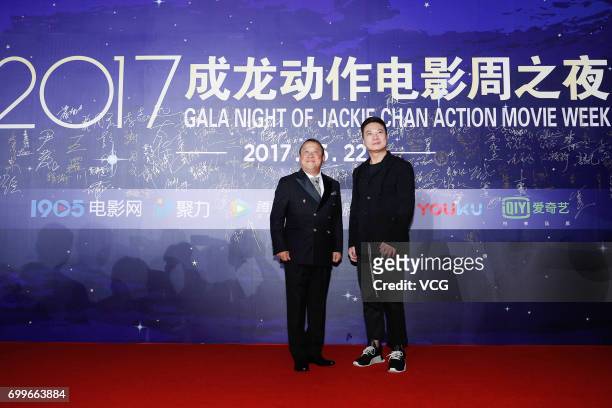 Actor Eric Tsang Chi-wai and actor Chin Ka-lok arrive at the red carpet of Gala Night of Jackie Chan Action Movie Week during the 20th Shanghai...