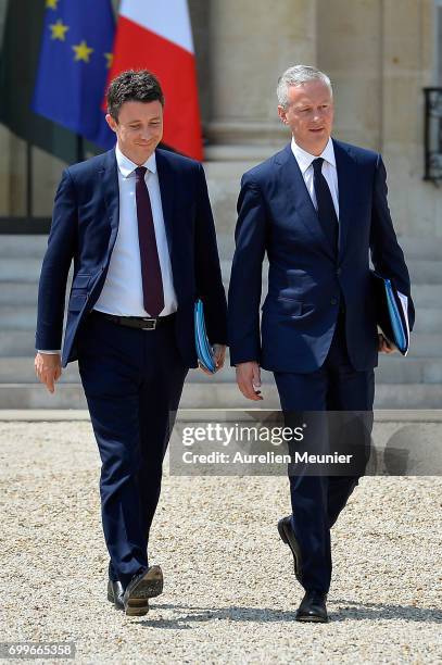 French junior Minister Benjamin Griveaux and French Economy Minister Bruno Le Maire leave the Elysee Palace after the weekly cabinet meeting with...