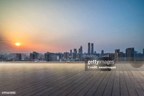 empty wooden platform with suzhou skyline in background at dusk. - shoes top view stock pictures, royalty-free photos & images