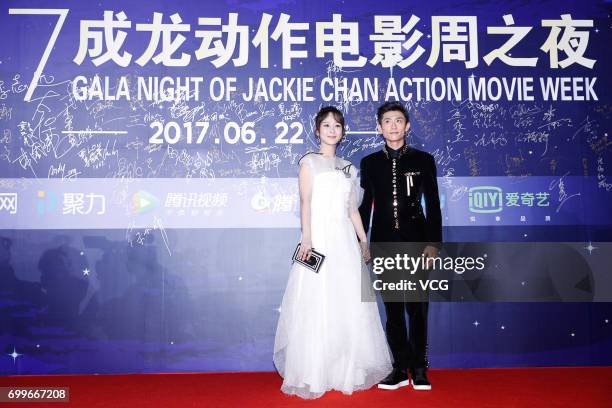 Actress Yang Zi and actor Zhang Yishan arrive at the red carpet of Gala Night of Jackie Chan Action Movie Week during the 20th Shanghai International...