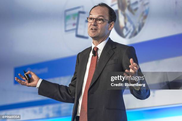 Mike Coupe, chief executive officer of J Sainsbury Plc, gestures as he speaks during a panel session at the 61st Global Summit of the Consumer Goods...