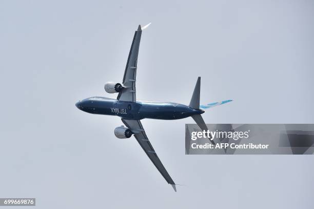 Boeing 737 MAX 9 performs a flying display during the International Paris Air Show in Le Bourget outside Paris on June 22, 2017. / AFP PHOTO /...