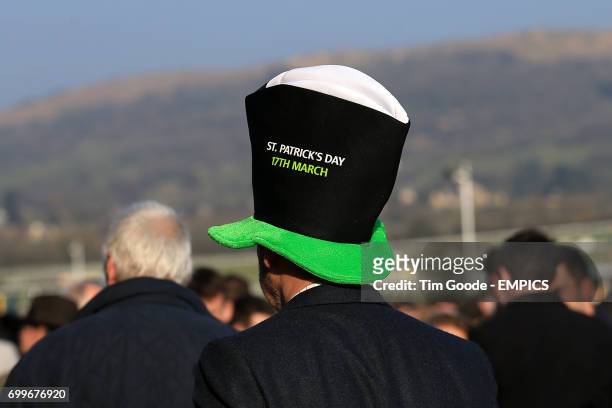 Racegoer wears a St Patrick's day Guinness hat during St Patrick's Thursday at the 2016 Cheltenham Festival at Cheltenham Racecourse.