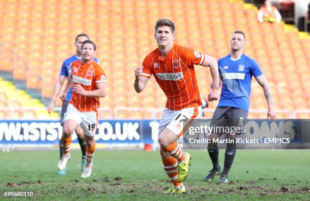 Blackpool's Danny Philliskirk celebrates scoring his side's first goal against Bury