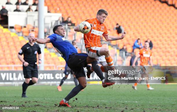 Blackpool's Jim McAlister is fouled by Bury's Tom Soares for a penalty