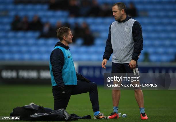 Coventry City's Joe Cole talks with Martin Lorentzson during warm up prior to Colchester United game