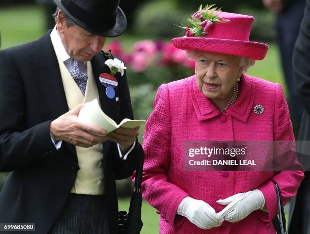 Britain's Queen Elizabeth II talks with the Queen's Bloodstock and Racing Advisor, John Warren as she arrives to attend Ladies Day at the Royal Ascot...