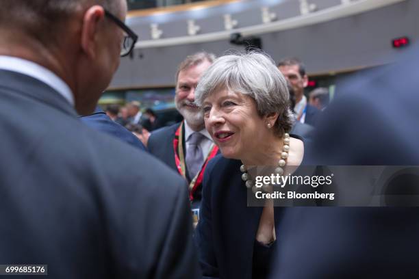 Theresa May, U.K. Prime minister, right, greets Juha Sipila, Finland's prime minister, left, as Tim Barrow, U.K. Permanent representative to the...