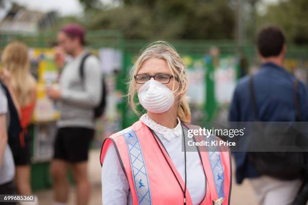 Festival worker wears a mask by the toilets on day 2 of the Glastonbury Festival 2017 at Worthy Farm, Pilton on June 23, 2017 in Glastonbury, England.