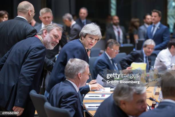 Tim Barrow, U.K. Permanent representative to the European Union , left, and Theresa May, U.K. Prime minister, center, arrive for the start of round...