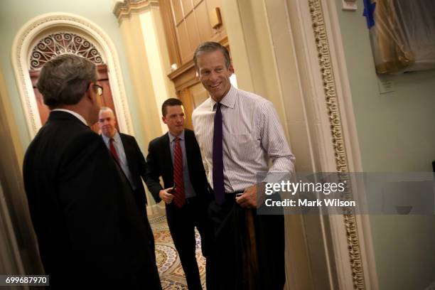 Sen. John Thune walks to a meeting where Republican members of the senate were expected to discuss their proposed health care bill June 22, 2017 in...