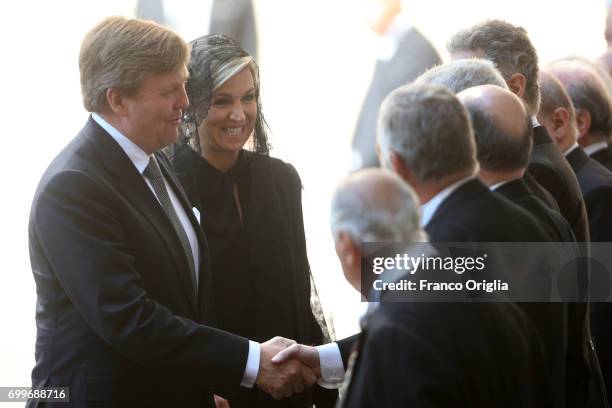 Dutch King Willem-Alexander and Queen Maxima greet Vatican Gemtlemen as they arrive at the Vatican for an audience with Pope Francis on June 22, 2017...