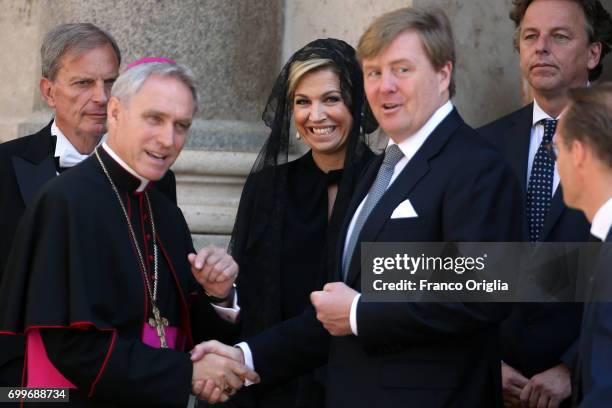 Prefect of the papal household Georg Gaenswein greets Dutch King Willem-Alexander and Queen Maxima as they leave the Apostolic Palace at the end of...