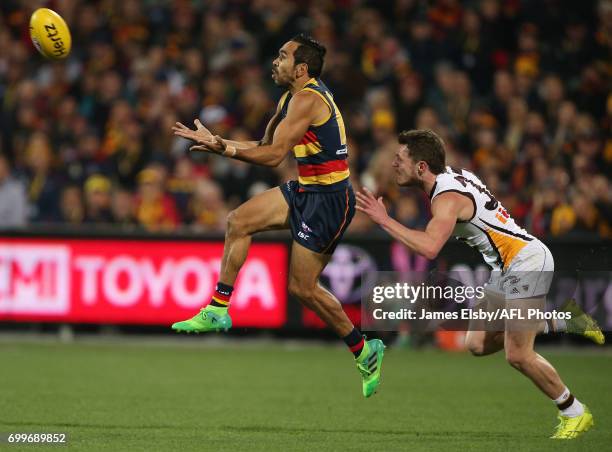 Eddie Betts of the Crows marks in front of Blake Hardwick of the Hawks during the 2017 AFL round 14 match between the Adelaide Crows and the Hawthorn...