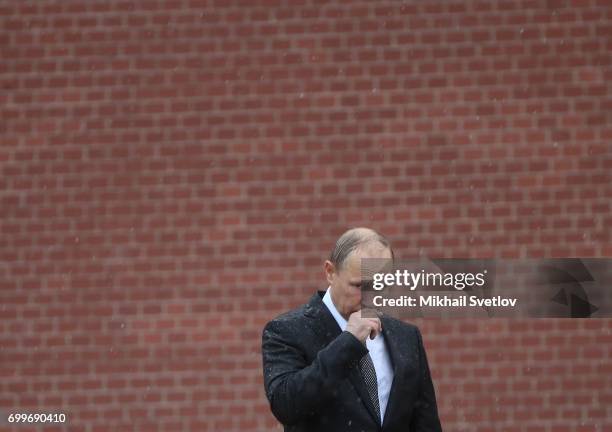 Russian President Vladimir Putin attends the wreath laying ceremony at the Unknown Soldier's Tomb at Alexander Garden outside of the Kremlin on June...