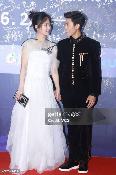 Actress Yang Zi and actor Zhang Yishan arrive at the red carpet of Gala Night of Jackie Chan Action Movie Week during the 20th Shanghai International...