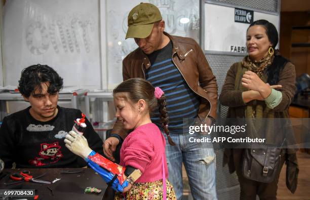 Colombian Shaio Valeria Novas tries her 3D printed prosthesis with a superhero "Wonder Woman" design, in Bogota, Colombia on June 12, 2017. Fabrilab...