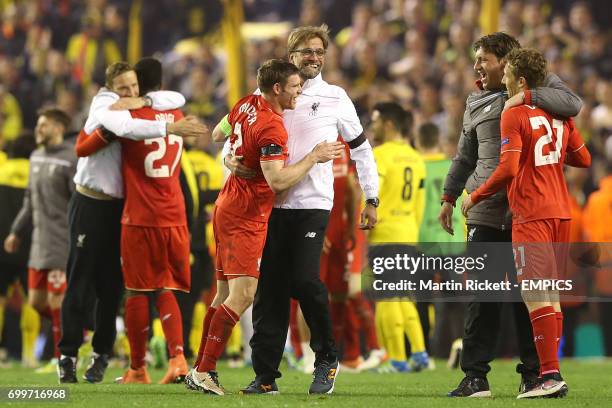 Liverpool's James Milner embraces manager Jurgen Klopp after the game.