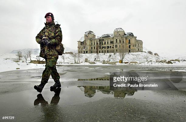 British Army Private Kevin Mc Laren from London patrols the snow covered streets by the Darulaman Palace February 8, 2002 in Kabul, Afghanistan. More...