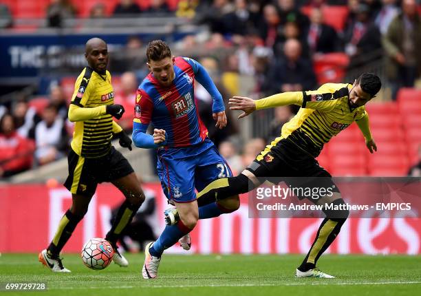 Crystal Palace's Connor Wickham goes down in the area after a challenge from Watford's Miguel Angel Britos