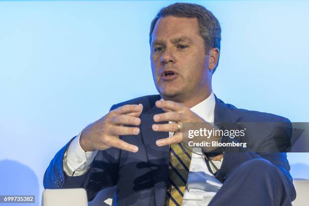 Doug McMillon, chief executive officer of Wal-Mart Stores Inc., gestures as he speaks during a panel session at the 61st Global Summit of the...
