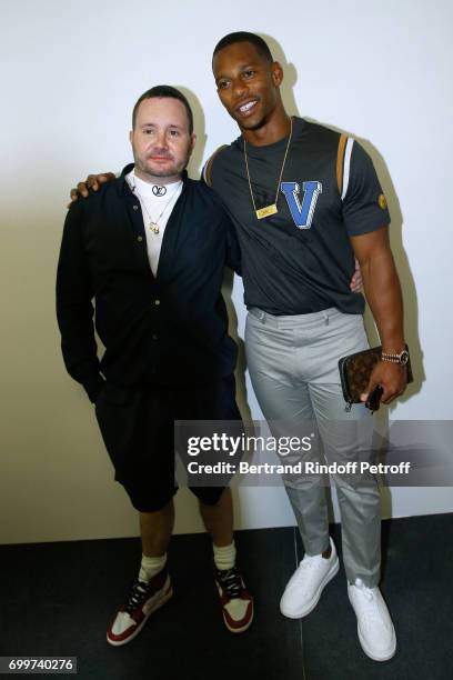 Stylist Kim Jones and American Football player Victor Cruz pose after the Louis Vuitton Menswear Spring/Summer 2018 show as part of Paris Fashion...