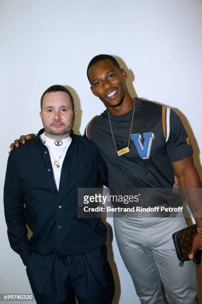 Stylist Kim Jones and American Football player Victor Cruz pose after the Louis Vuitton Menswear Spring/Summer 2018 show as part of Paris Fashion...