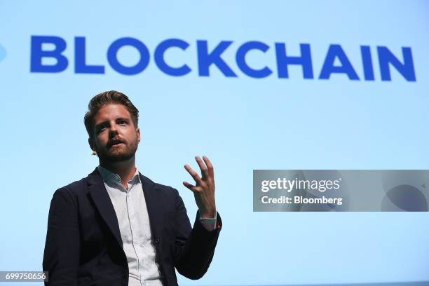 Peter Smith, chief executive officer of Blockchain Ltd., gestures as he speaks during the Noah technology conference in Berlin, Germany, on Thursday,...
