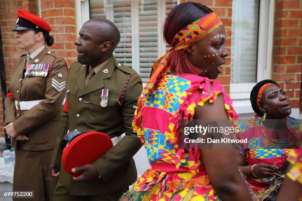 Performers and cadets wait as a memorial honoring the two million African and Caribbean military servicemen and women who served in World War I and...